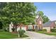 Beautifully landscaped two-story brick home with a charming entryway and well-maintained lawn at 130 White Sands Ct, Suwanee, GA 30024