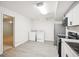This kitchen includes stainless steel appliances, modern cabinetry, and washer/dryer at 130 White Sands Ct, Suwanee, GA 30024