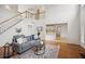 Spacious living room with hardwood floors, open floor plan, and elegant decor at 130 White Sands Ct, Suwanee, GA 30024