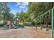 Community playground features a swing set, slides, and climbing area, all with safety mulch at 130 White Sands Ct, Suwanee, GA 30024