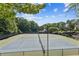 Well-maintained community tennis courts with lush surrounding greenery, providing an active lifestyle at 130 White Sands Ct, Suwanee, GA 30024