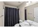 Bathroom featuring a shower with a dark curtain and marble-look vanity at 133 Worthing Ln, Fairburn, GA 30213