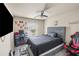 bedroom with ceiling fan, mounted TV, decor, and lots of storage at 133 Worthing Ln, Fairburn, GA 30213