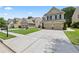 Inviting two-story home boasts a well-kept lawn and a concrete driveway leading to an attached two-car garage at 133 Worthing Ln, Fairburn, GA 30213