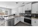 Bright kitchen featuring modern appliances and a dining area at 133 Worthing Ln, Fairburn, GA 30213