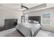 Spacious bedroom featuring a ceiling fan, dresser, and lots of natural light at 133 Worthing Ln, Fairburn, GA 30213