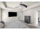 Comfortable bedroom featuring a ceiling fan, dresser, and a mounted TV at 133 Worthing Ln, Fairburn, GA 30213