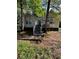 Inviting home featuring an exterior deck and stairs surrounded by mature trees at 4050 Willow Ridge Rd, Douglasville, GA 30135