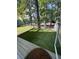 Outdoor patio area with artificial turf and a view of the spacious backyard at 4050 Willow Ridge Rd, Douglasville, GA 30135