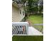Backyard with stairs from the deck, leading to the lawn surrounded by mature trees at 4050 Willow Ridge Rd, Douglasville, GA 30135