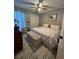 This bedroom has a queen bed and neutral color scheme at 4050 Willow Ridge Rd, Douglasville, GA 30135