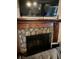 Living room fireplace with stone facade and wooden mantel at 4050 Willow Ridge Rd, Douglasville, GA 30135