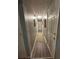 A long hallway with hardwood flooring and paneled doors at 4050 Willow Ridge Rd, Douglasville, GA 30135
