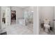 Bathroom with a glass-enclosed shower, a soaking tub, and sleek fixtures, designed for relaxation and convenience at 490 Duval Dr, Alpharetta, GA 30009