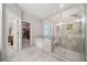 Bathroom featuring a large shower, soaking tub, and modern fixtures, creating a spa-like retreat at 490 Duval Dr, Alpharetta, GA 30009