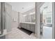 Serene bathroom featuring double sinks, vanity, and walk-in shower with tiled accents, enhancing the space's appeal at 490 Duval Dr, Alpharetta, GA 30009