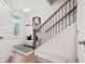 Inviting foyer with a staircase, bench seating, hardwood floors, and ample natural light at 490 Duval Dr, Alpharetta, GA 30009