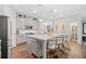 Contemporary kitchen with a center island, stainless steel appliances, and barstool seating at 490 Duval Dr, Alpharetta, GA 30009
