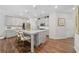 Modern kitchen featuring a center island, stainless steel appliances, and ample cabinet space at 490 Duval Dr, Alpharetta, GA 30009