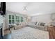 Expansive living room with open concept and chandelier at 490 Duval Dr, Alpharetta, GA 30009