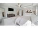 Relaxing bedroom with plush carpet, tray ceiling, large windows, and generous space, inviting comfort and tranquility at 490 Duval Dr, Alpharetta, GA 30009
