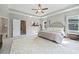 Inviting bedroom with neutral color palette and natural light that showcases a cozy and relaxing retreat at 490 Duval Dr, Alpharetta, GA 30009