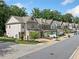 Charming townhomes with attached garages line a beautifully landscaped street, offering a sense of community at 490 Duval Dr, Alpharetta, GA 30009