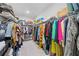 Well-organized walk-in closet with ample shelving and hanging space, offering plenty of storage for clothing and accessories at 490 Duval Dr, Alpharetta, GA 30009