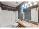 Bathroom features a shower-tub combination and granite countertops at 12384 Riviera Dr, Fayetteville, GA 30215