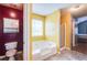 A bathroom shows a shower and tub combination at 12384 Riviera Dr, Fayetteville, GA 30215