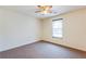 Bedroom featuring a ceiling fan and a window at 12384 Riviera Dr, Fayetteville, GA 30215