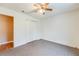 Bedroom features a ceiling fan and closet at 12384 Riviera Dr, Fayetteville, GA 30215