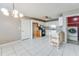 Eat-in kitchen features white cabinets, tile backsplash, modern appliances, and a center island at 12384 Riviera Dr, Fayetteville, GA 30215