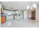 Bright kitchen with white cabinetry, a tile backsplash, and an island for added prep space at 12384 Riviera Dr, Fayetteville, GA 30215