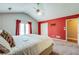 This primary bedroom features a ceiling fan and closet at 12384 Riviera Dr, Fayetteville, GA 30215