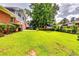 A sprawling backyard with well-maintained lawn and mature trees at 3755 Greentree Dr, Decatur, GA 30032