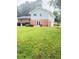 View of backyard featuring grass, fence, and two story house at 3755 Greentree Dr, Decatur, GA 30032