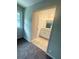 Attached bath showing tile floors, vanity with granite countertops, and modern lighting at 3755 Greentree Dr, Decatur, GA 30032