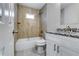 Beautiful bathroom featuring granite countertops, a shower-tub combo, and modern fixtures at 3755 Greentree Dr, Decatur, GA 30032