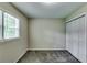 Simple bedroom with a large window and closet at 3755 Greentree Dr, Decatur, GA 30032