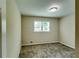 Bright bedroom with neutral walls, carpet flooring, and a large window offering natural light at 3755 Greentree Dr, Decatur, GA 30032