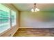 Dining room with hardwood floors, chandelier and window, creating a cozy space at 3755 Greentree Dr, Decatur, GA 30032