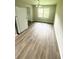 Dining room with hardwood floors, bright natural light, and a modern chandelier at 3755 Greentree Dr, Decatur, GA 30032