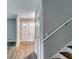 Bright entryway featuring hardwood floors, leading to a white paneled door with window panes at 3755 Greentree Dr, Decatur, GA 30032