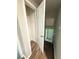 Bright hallway with white trim and gray walls, leading to the lower level at 3755 Greentree Dr, Decatur, GA 30032
