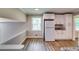 Bright kitchen with white appliances, granite countertops, and natural light at 3755 Greentree Dr, Decatur, GA 30032