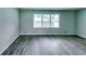 Spacious living room with hardwood floors, light walls, and large windows offering natural light at 3755 Greentree Dr, Decatur, GA 30032