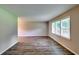 Bright living room with hardwood floors and large windows providing ample natural light at 3755 Greentree Dr, Decatur, GA 30032