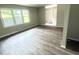Bright living room featuring hard surface floors, large window, and neutral paint at 3755 Greentree Dr, Decatur, GA 30032