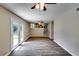 Open living space with hardwood floors and backyard access, with a view to the kitchen at 3755 Greentree Dr, Decatur, GA 30032